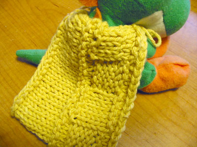 Knit-and-purl swatch-turned-cape for Yoshi